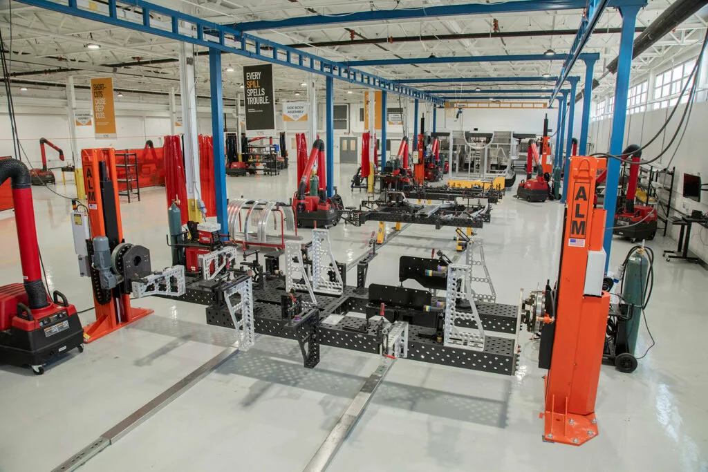 Bluco engineers worked collaboratively with DTM to develop this finished solution, which includes 14 weld cells and a new time-saving process that included floor rails that allowed the team to marry together subassemblies with extreme accuracy. 2022/05/DTM-Facility.jpeg 