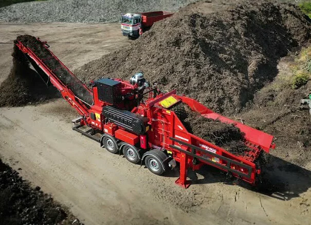 A finished Wood Hog, shown here with its conveyor, supported by a bumper assembly that must be precisely assembled. 2024/05/Morbark-finished-Wood-Hog_Bluco-Case-Study.jpg 